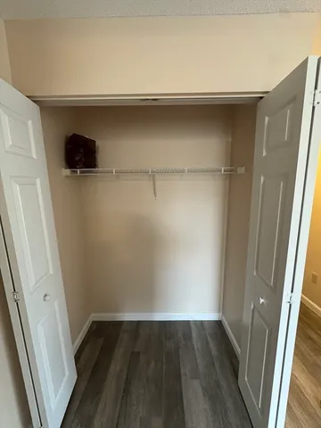 a view of an empty walk in closet
