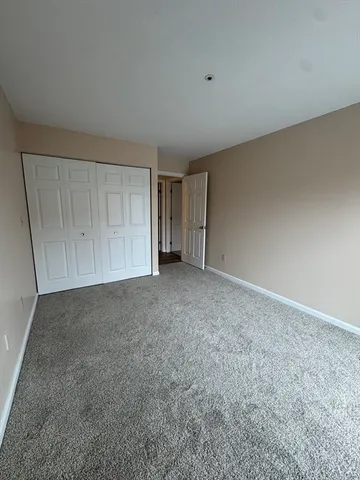 a view of an empty room and entryway