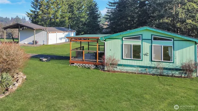 a house with green field in front of it