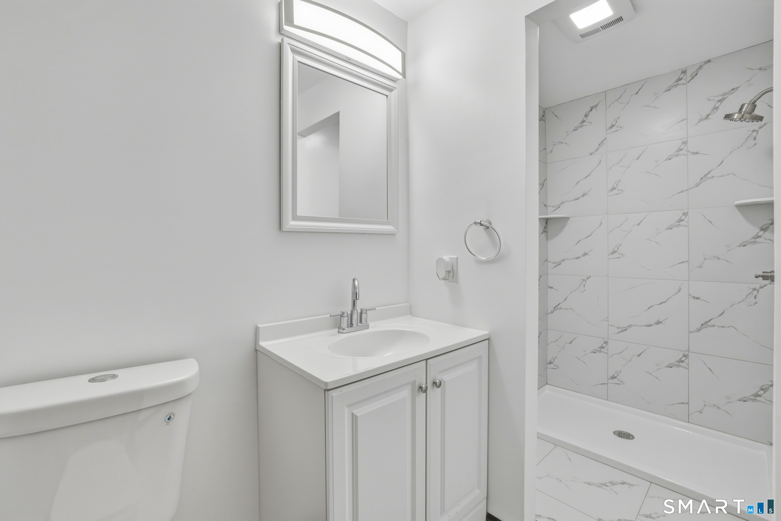 275 Broad Street, Unit 9 Meriden, CT 06450 - Photo 11 of 21 a bathroom with a sink a toilet and shower