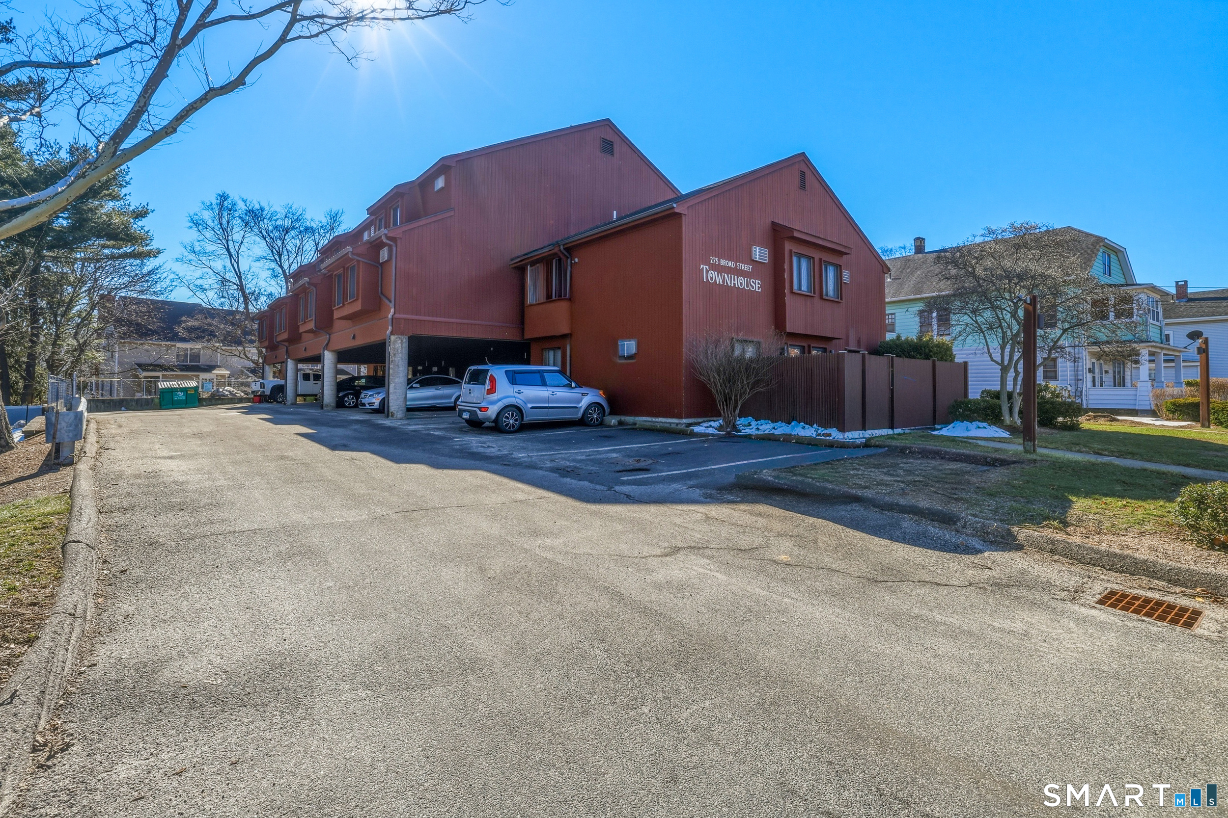 275 Broad Street, Unit 9 Meriden, CT 06450 - Photo 13 of 21 a front view of a house with a yard and garage
