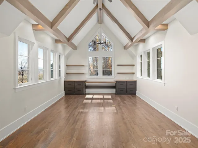 a bathroom with a granite countertop toilet sink and mirror