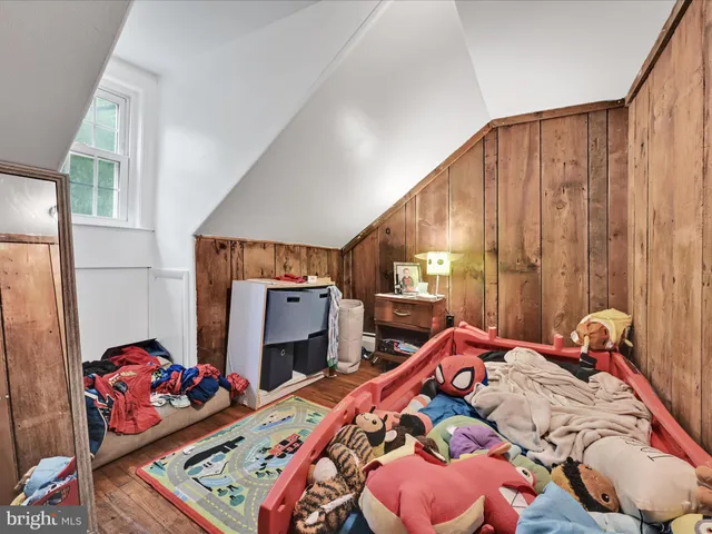 a bed room with two beds and a couch