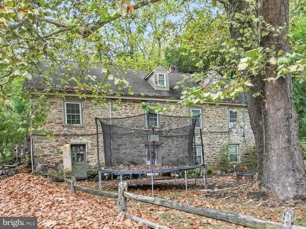 a aerial view of a house with a yard and plants