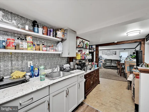a kitchen with stainless steel appliances a stove and cabinets