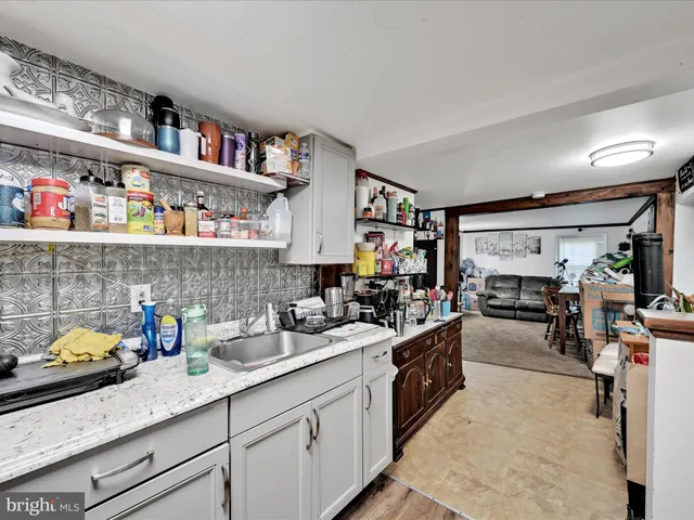 a kitchen with stainless steel appliances a stove and cabinets