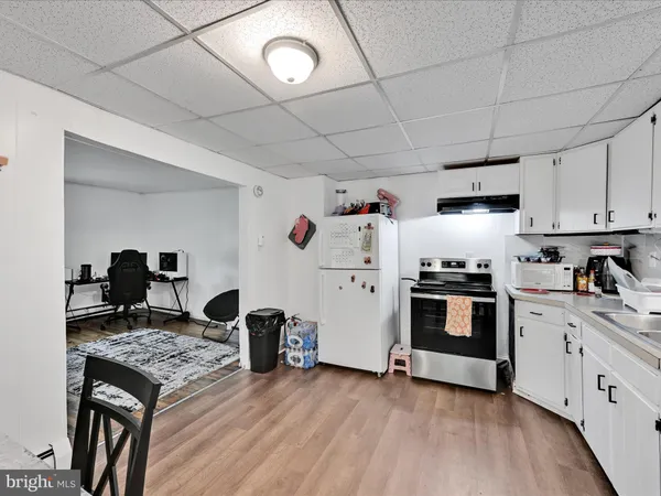 a kitchen with stainless steel appliances granite countertop a stove and a refrigerator