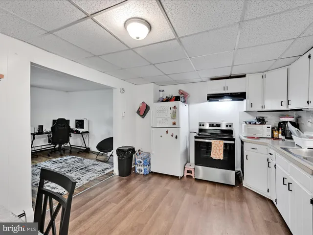 a kitchen with stainless steel appliances granite countertop a stove and a refrigerator