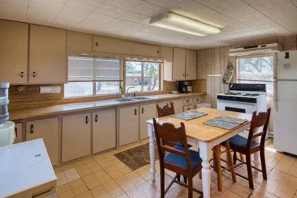 a kitchen that has a cabinets counter space and appliances