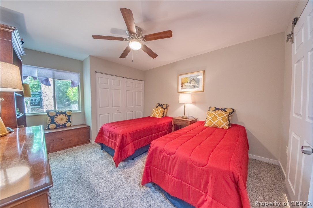68 Villa Ridge Drive, Unit 4 Hartfield, VA 23071 - Photo 15 of 30 Bedroom #1 has large window and barn door to full bath.