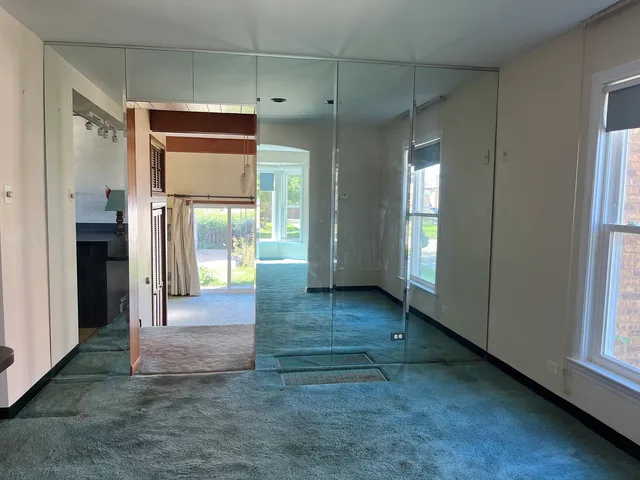 a view of gallery with wooden floor