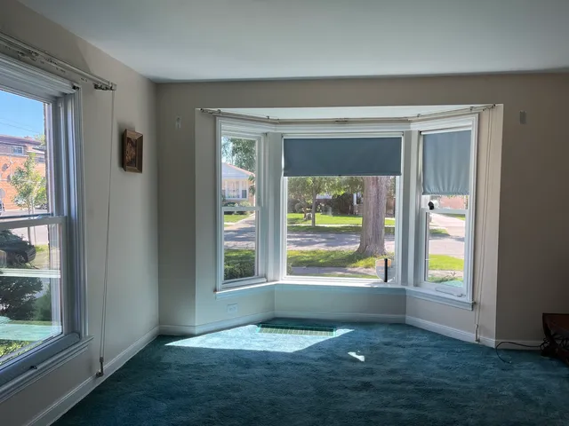 a view of an empty room and window