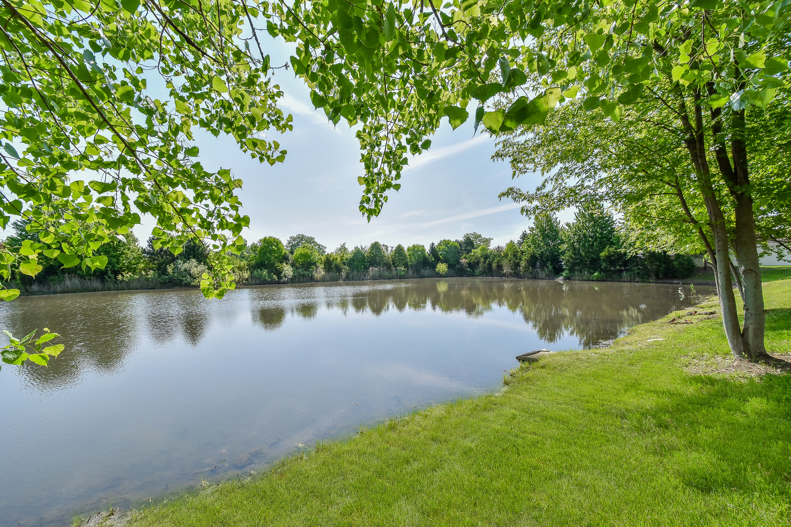 1556 McClure Road, Unit 1556 Aurora, IL 60505 - Photo 16 of 17 a lake view with a outdoor space