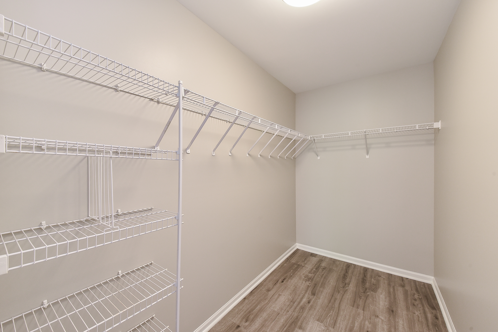 1556 McClure Road, Unit 1556 Aurora, IL 60505 - Photo 10 of 17 a view of walk in closet with empty racks