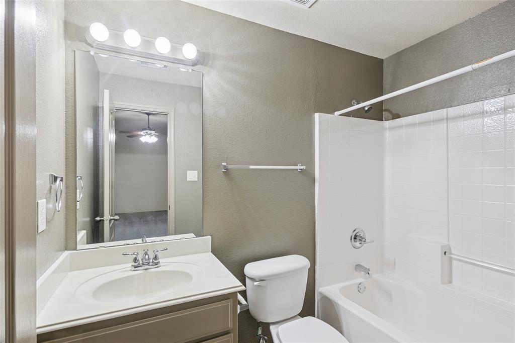 1749 Potomac Drive, Unit R Burleson, TX 76028 - Photo 11 of 15 a bathroom with a sink toilet and shower