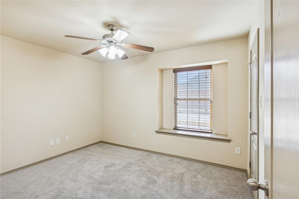 1749 Potomac Drive, Unit R Burleson, TX 76028 - Photo 13 of 15 an empty room with windows and fan