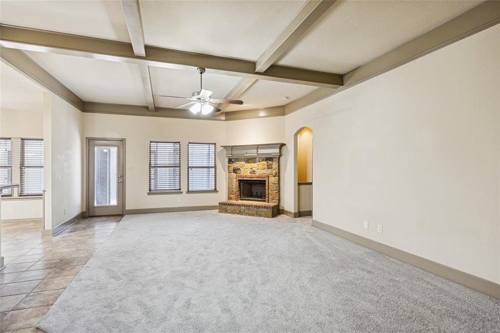 1749 Potomac Drive, Unit R Burleson, TX 76028 - Photo 4 of 15 an empty room with windows and fireplace