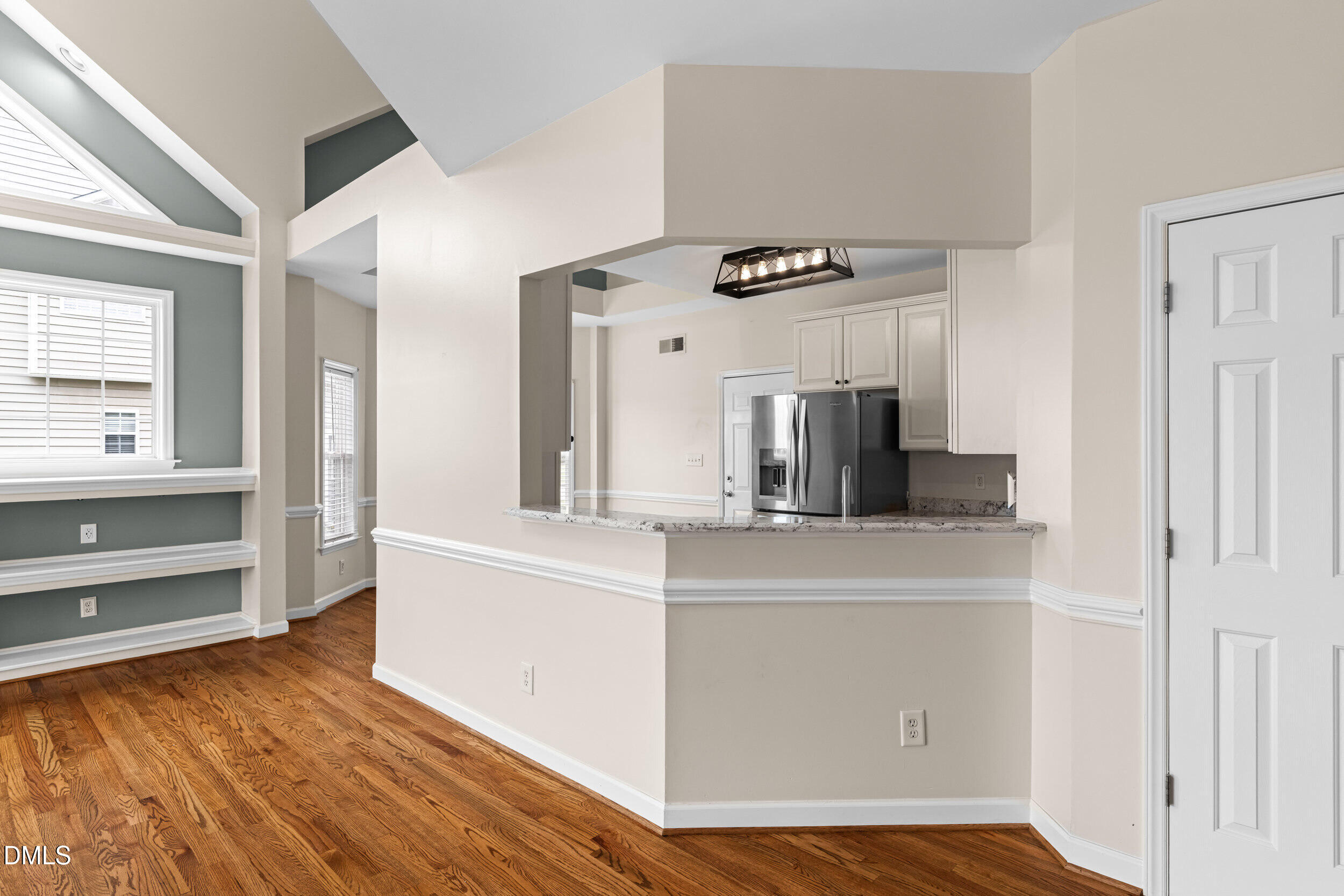 744 Seastone Street Raleigh, NC 27603 - Photo 15 of 53 a view of kitchen with cabinets and wooden floor