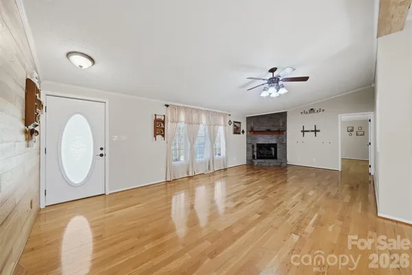 a view of a livingroom with furniture and a fireplace