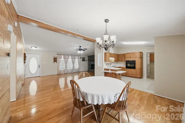 a large kitchen with kitchen island a sink stove and refrigerator