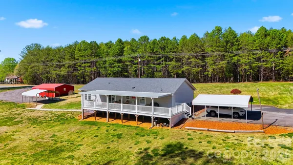 a view of a swimming pool with an outdoor seating and yard