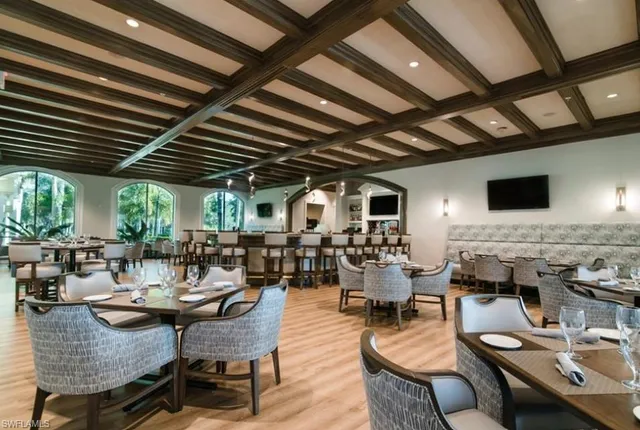 a living room with lots of furniture and fireplace