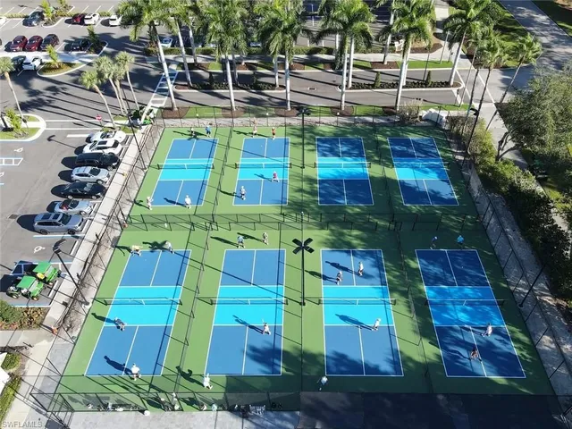 a view of a lake with houses in the back