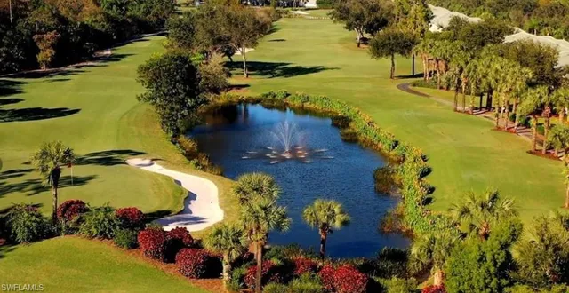 an aerial view of ocean boats and trees
