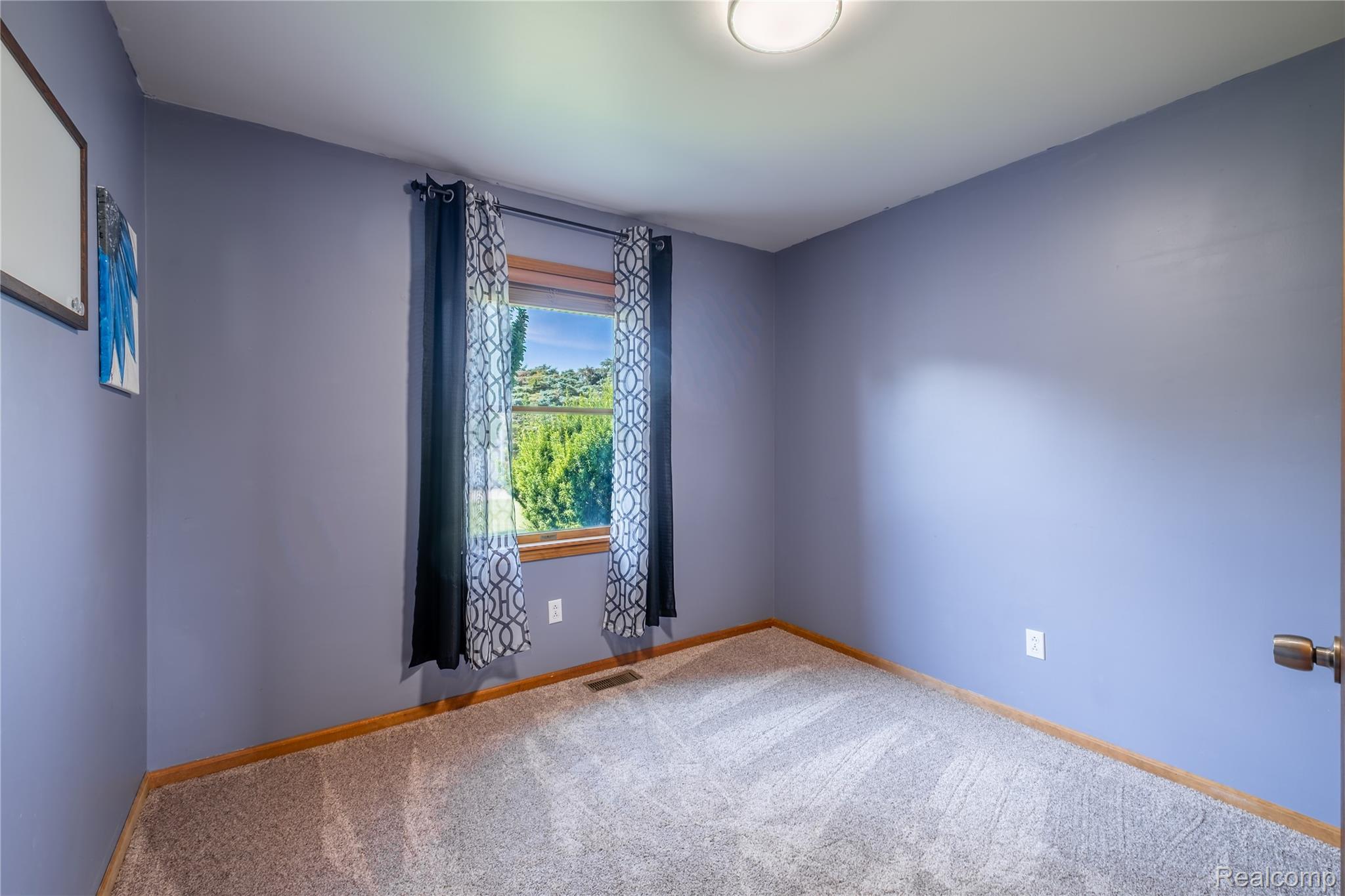 9600 Hamill Road Otisville, MI 48463 - Photo 16 of 32 Neutral-toned carpet flooring with light blue wall paint