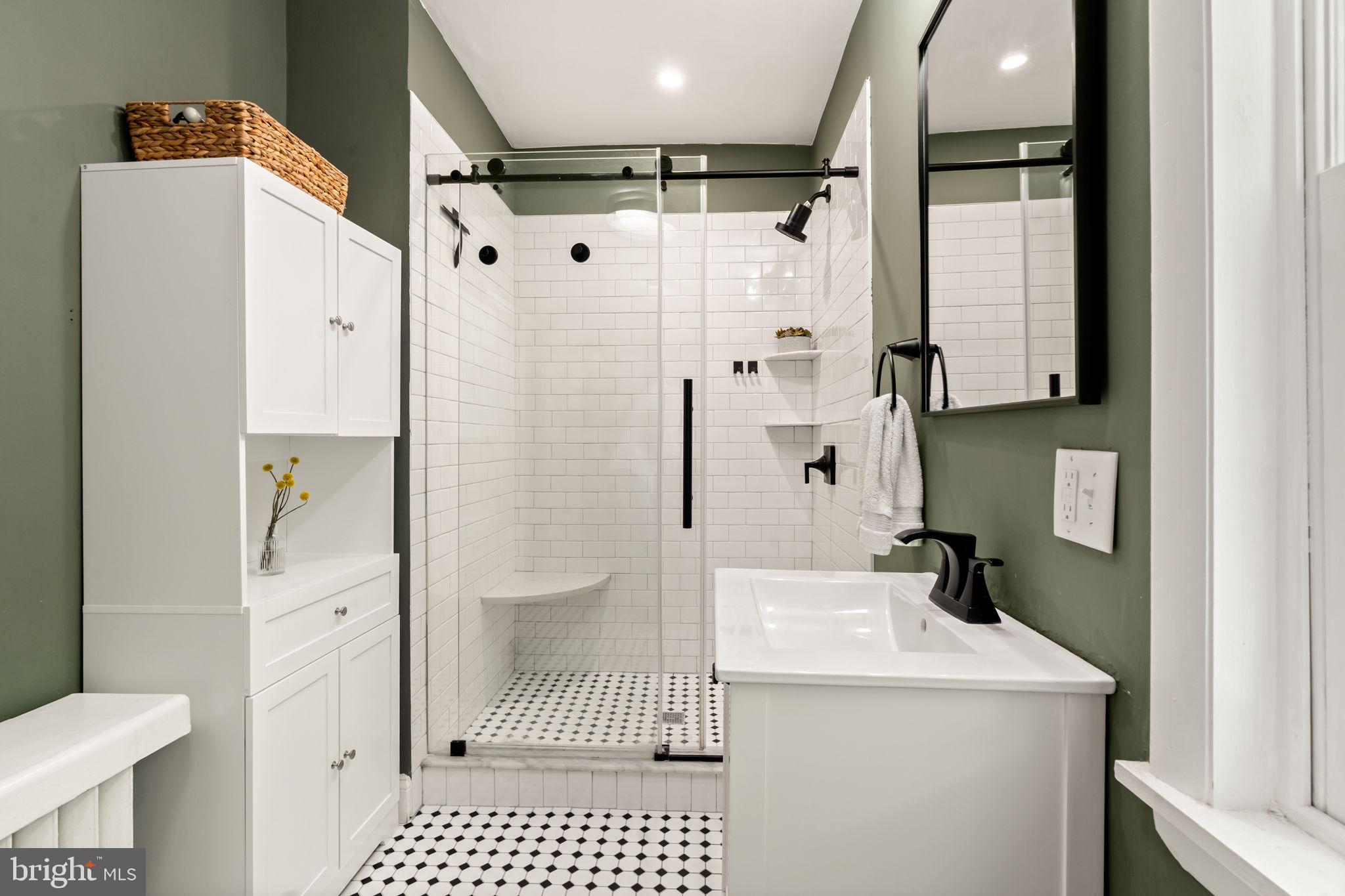 4751 Fowler Street Philadelphia, PA 19127 - Photo 11 of 26 a bathroom with a sink a toilet and shower