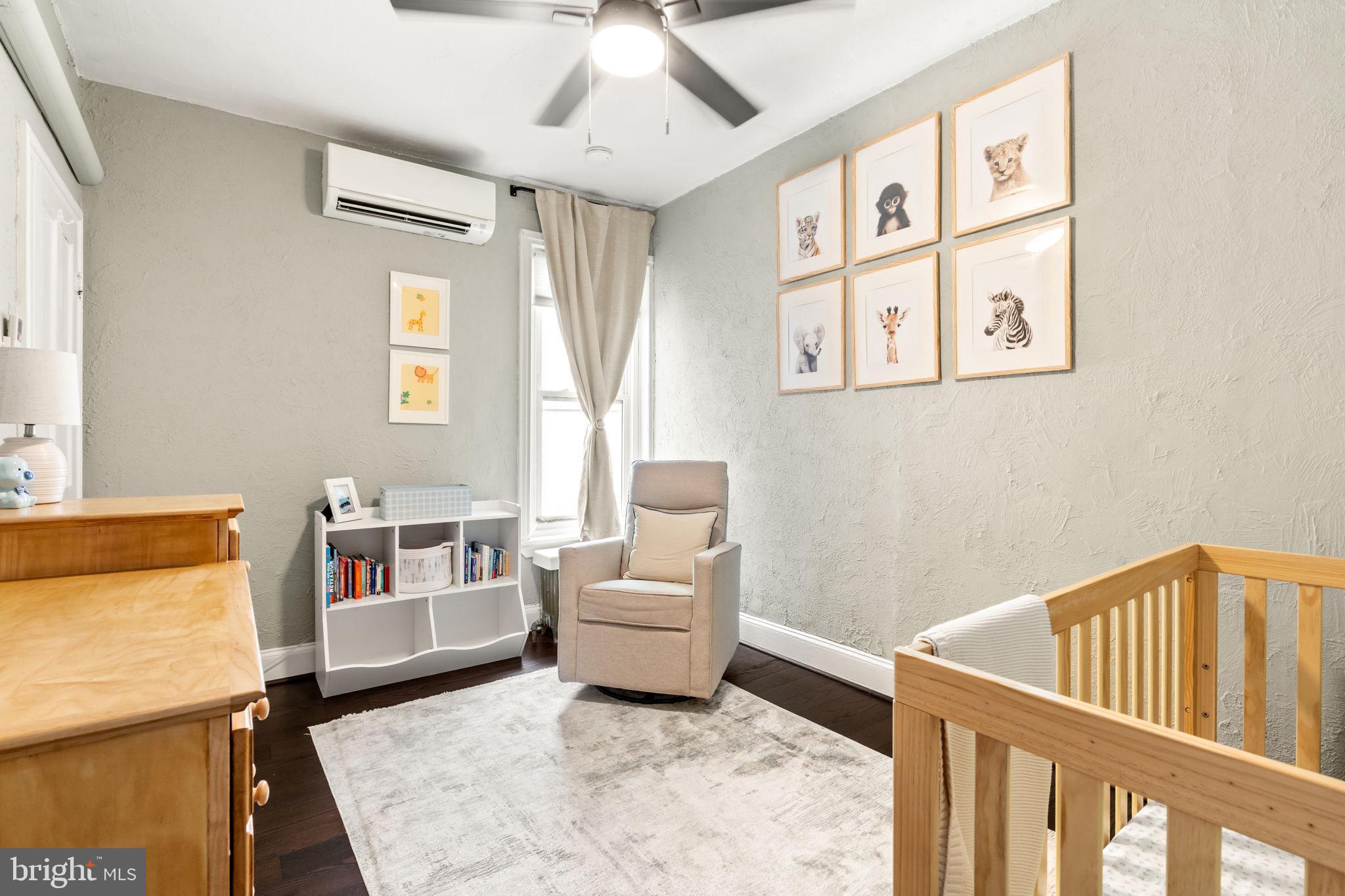 4751 Fowler Street Philadelphia, PA 19127 - Photo 14 of 26 a living room with furniture and a baby crib