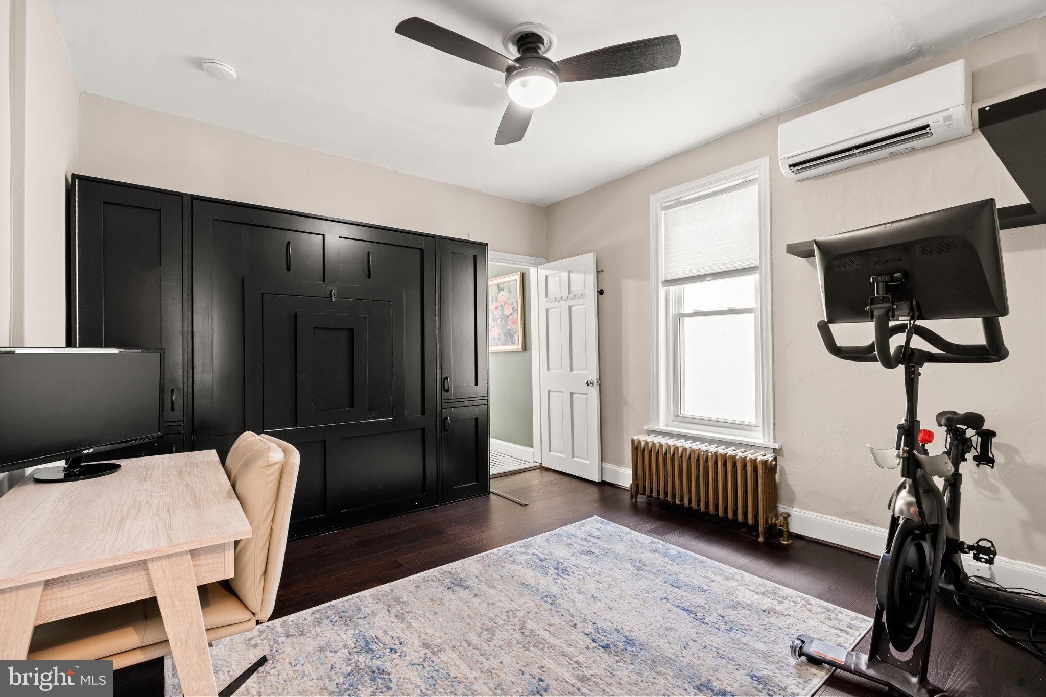 4751 Fowler Street Philadelphia, PA 19127 - Photo 15 of 26 a livingroom with furniture a flat screen tv and a ceiling fan