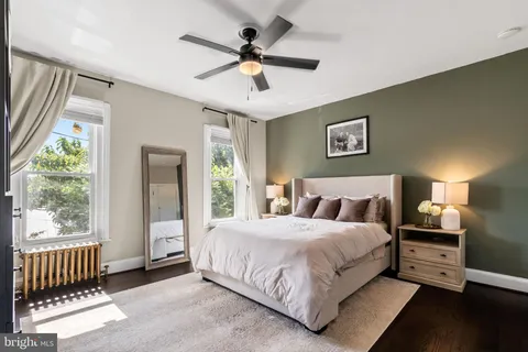 a bedroom with a bed and window