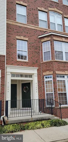 a front view of a house with a fence