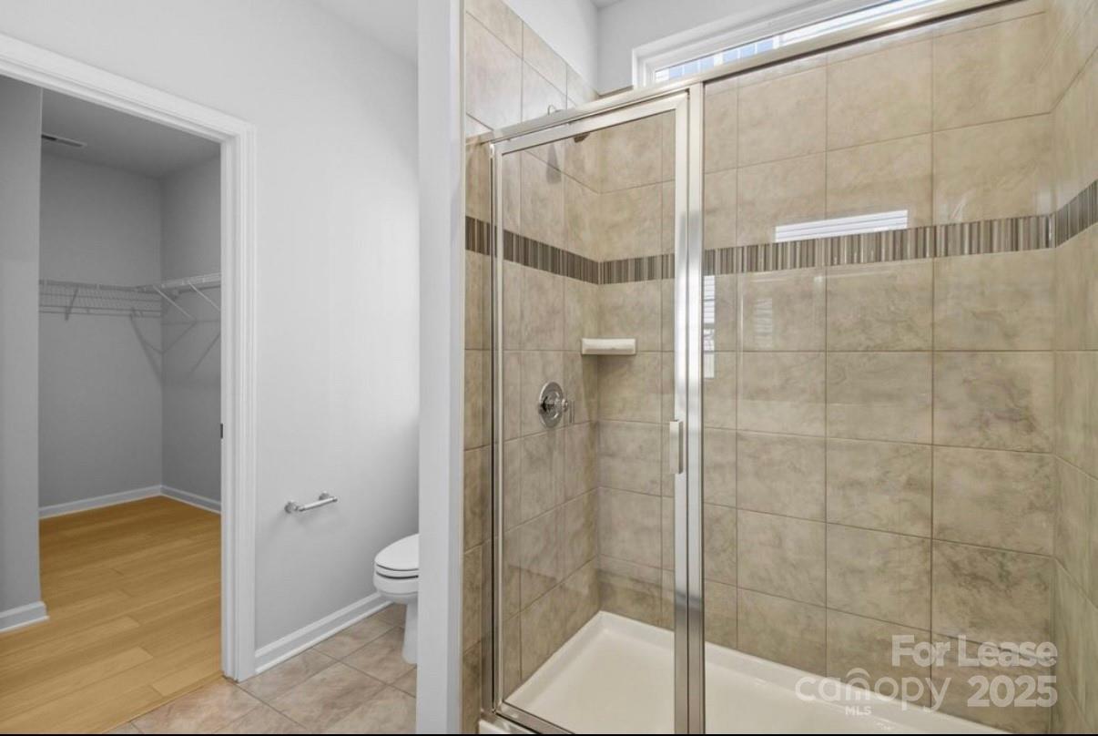 4326 Shimmering Stone Way Maiden, NC 28650 - Photo 15 of 27 a bathroom that has a glass shower door