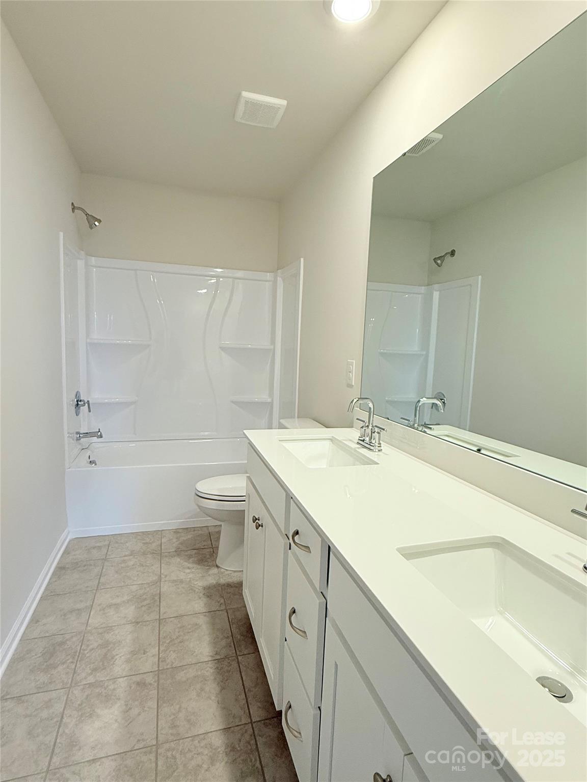4326 Shimmering Stone Way Maiden, NC 28650 - Photo 20 of 27 a spacious bathroom with a granite countertop sink a toilet and shower