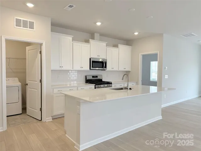 a view of a kitchen with a sink