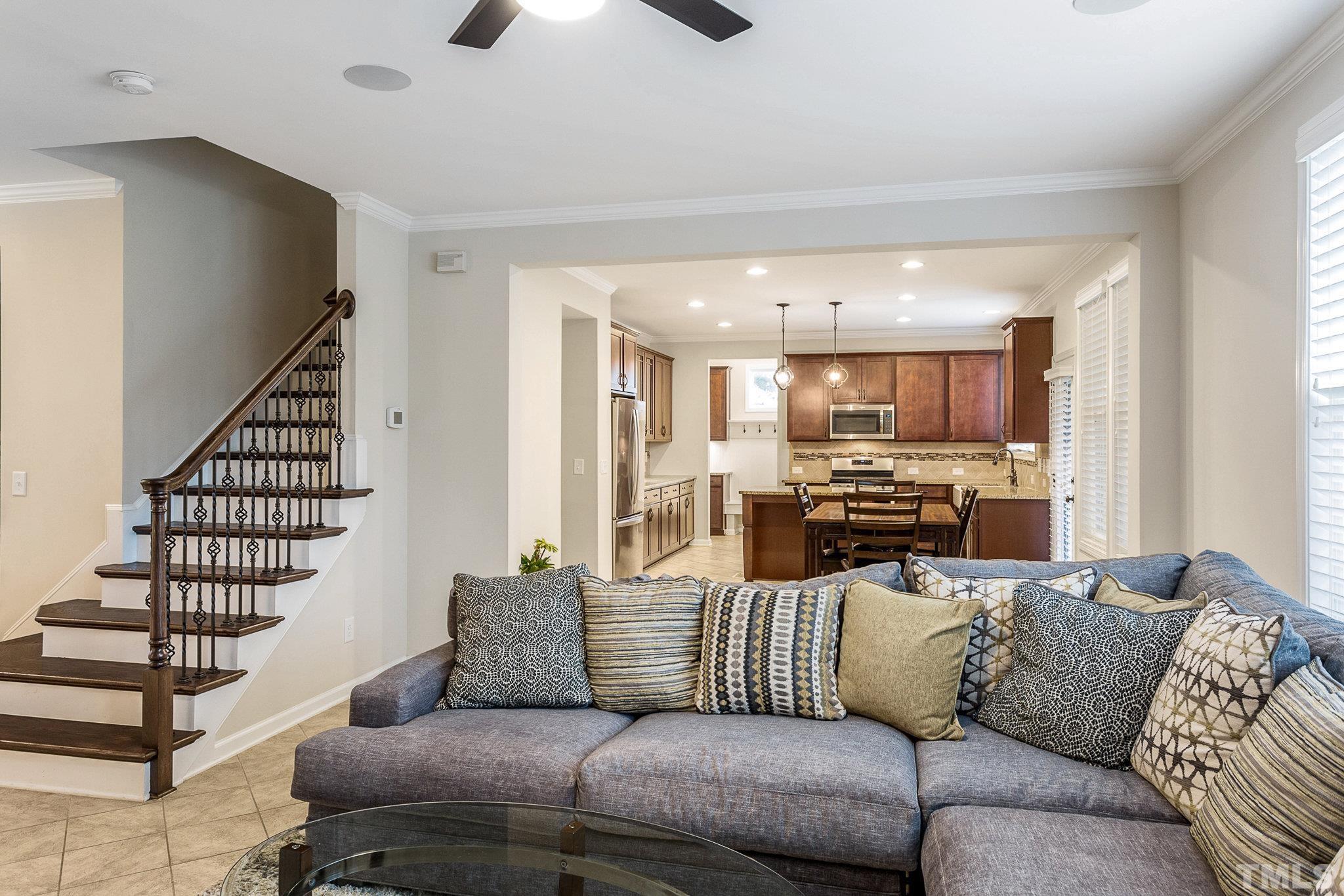 1214 Raleigh Street Oxford, NC 27565 - Photo 13 of 40 a living room with furniture kitchen view and a chandelier