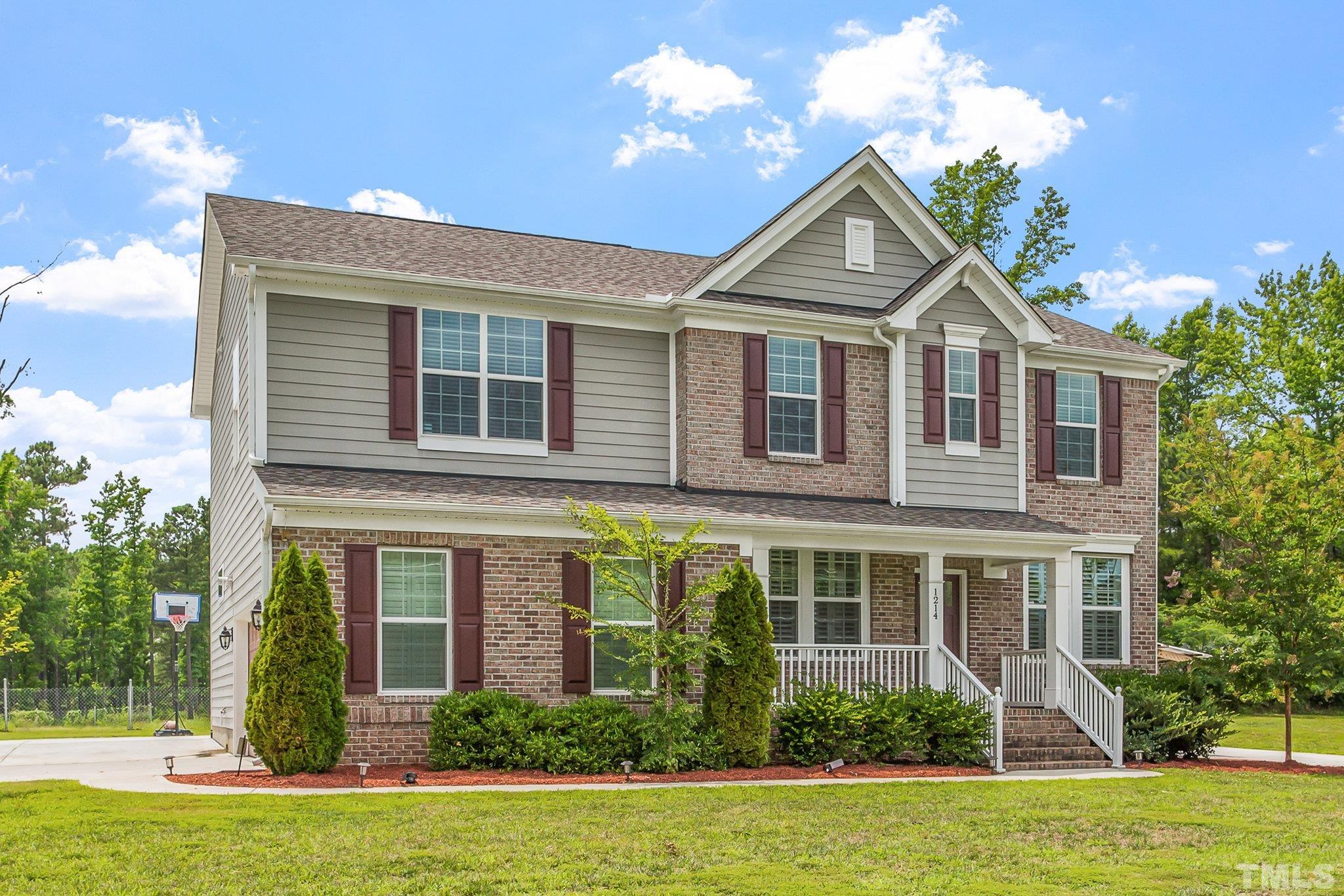 1214 Raleigh Street Oxford, NC 27565 - Photo 2 of 40 a front view of a house with garden