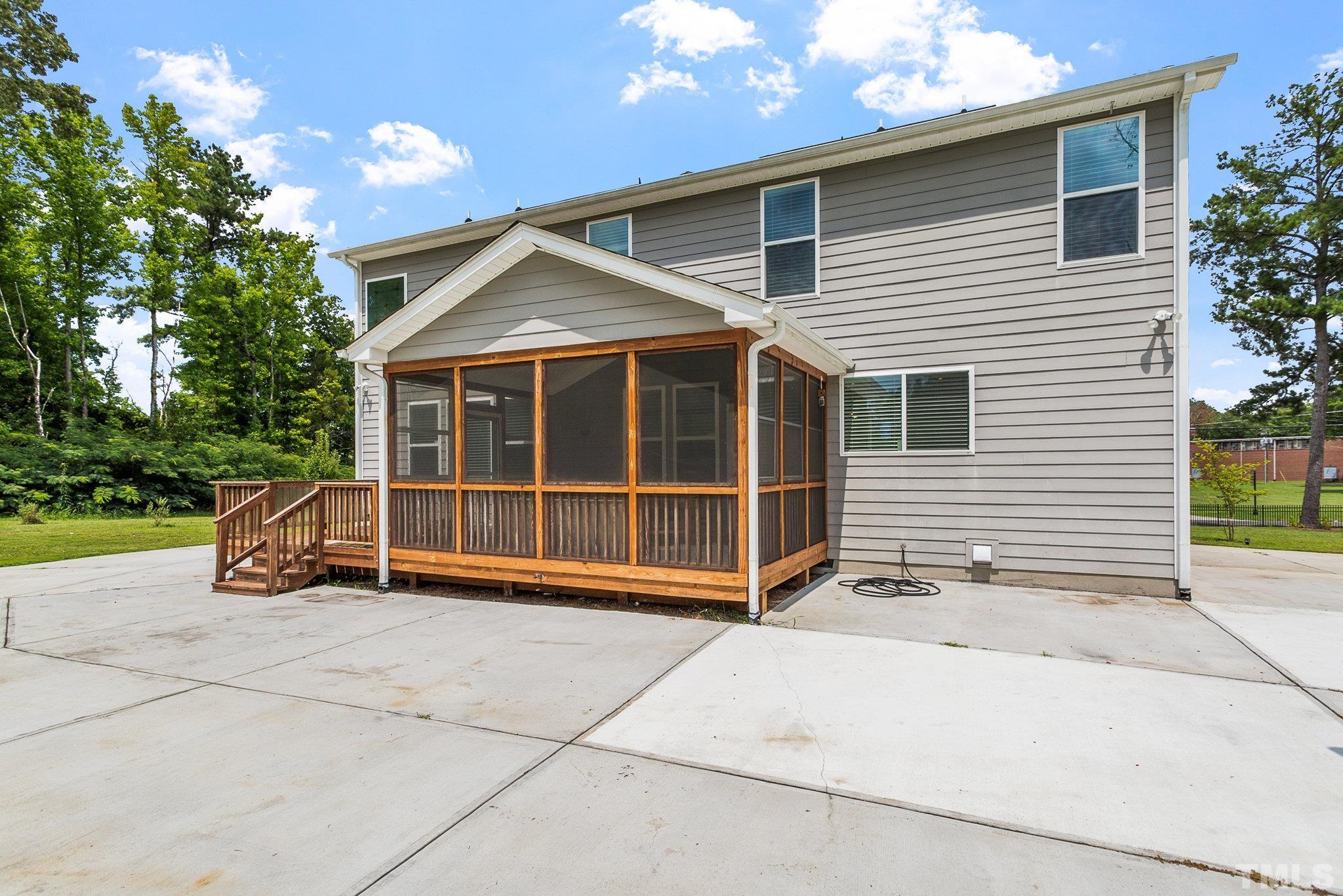 1214 Raleigh Street Oxford, NC 27565 - Photo 36 of 40 a view of a house with a yard and potted plants