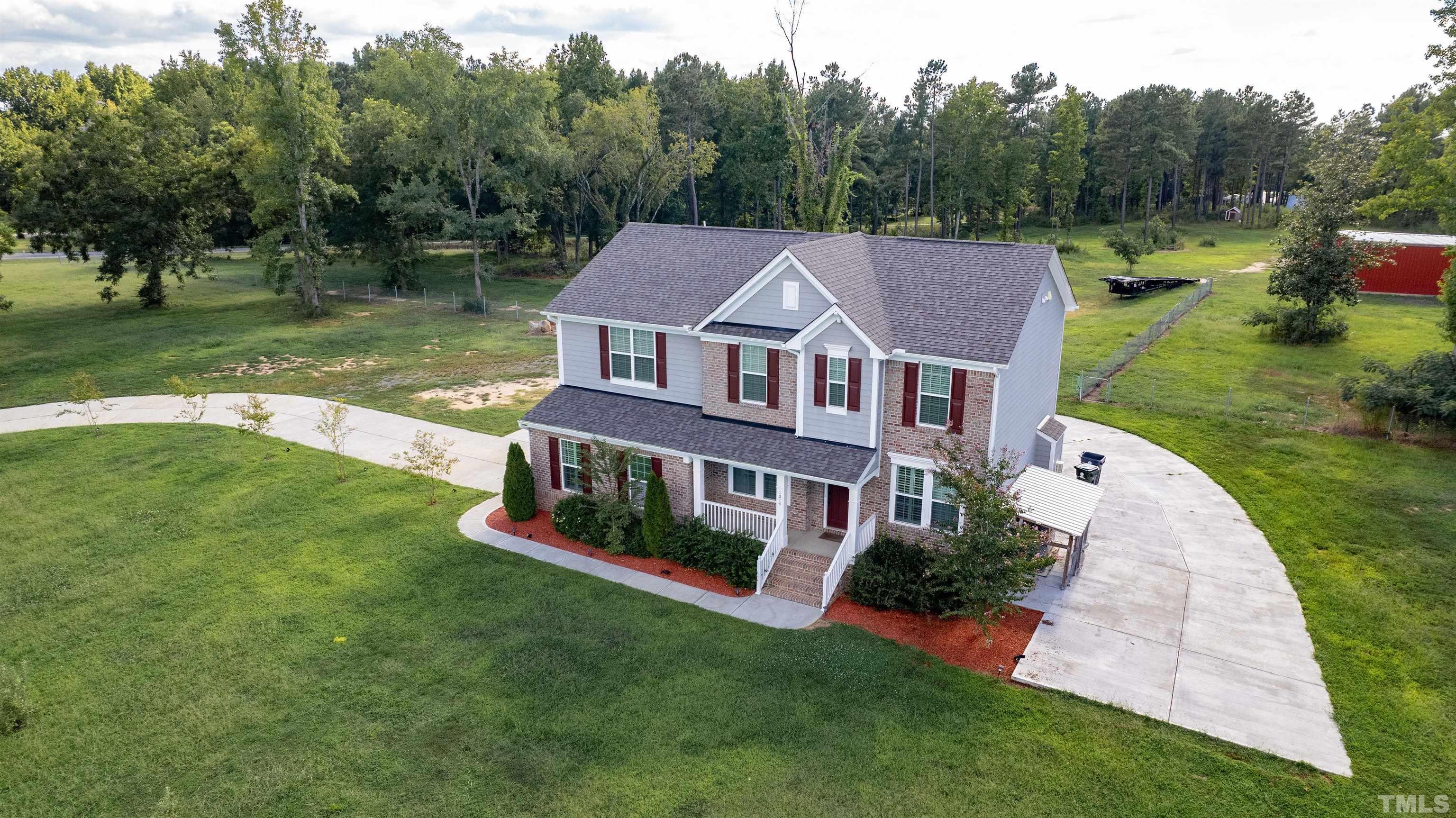 1214 Raleigh Street Oxford, NC 27565 - Photo 4 of 40 a aerial view of a house with swimming pool and a yard