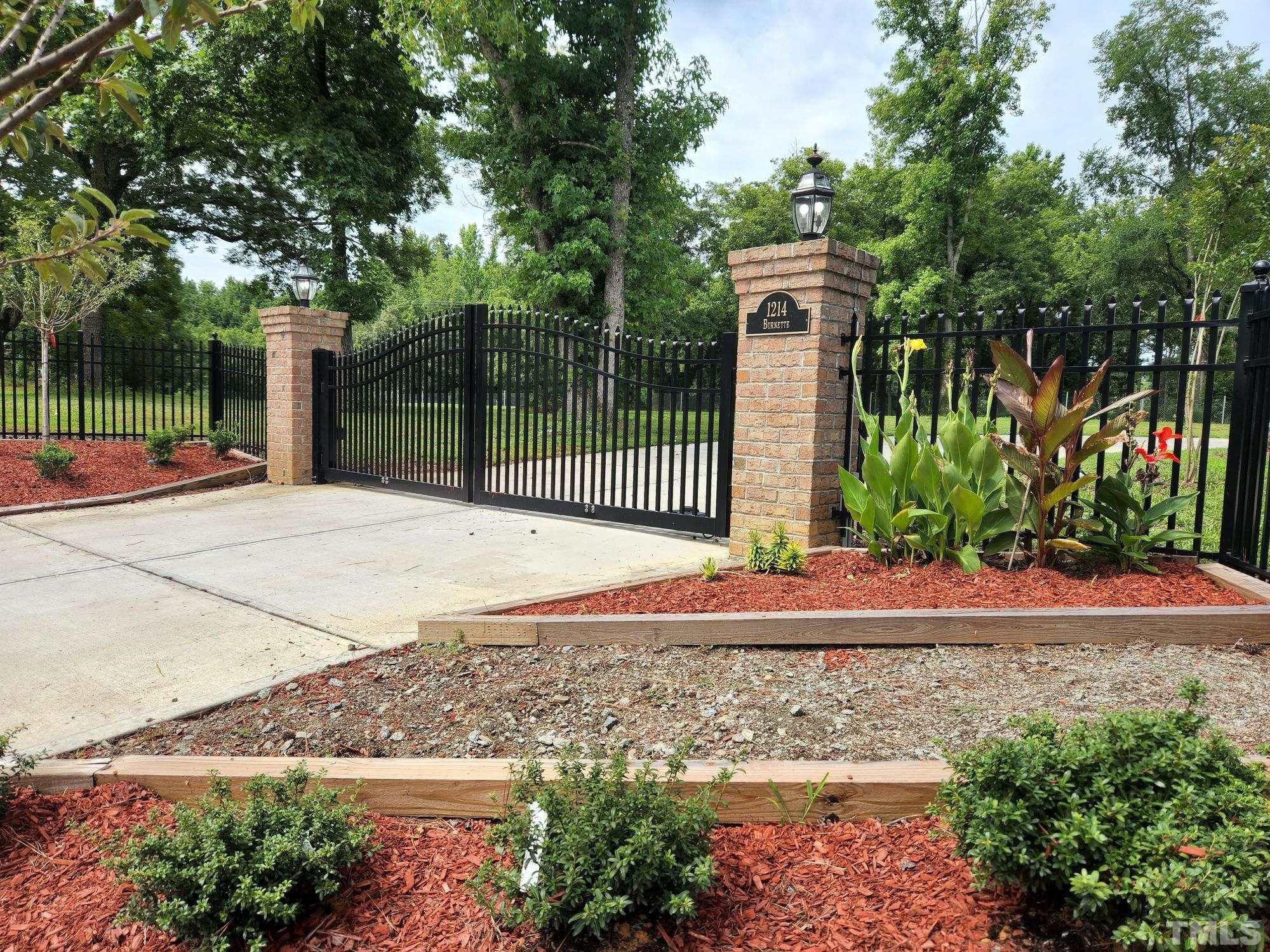 1214 Raleigh Street Oxford, NC 27565 - Photo 7 of 40 front view of a house with a garden