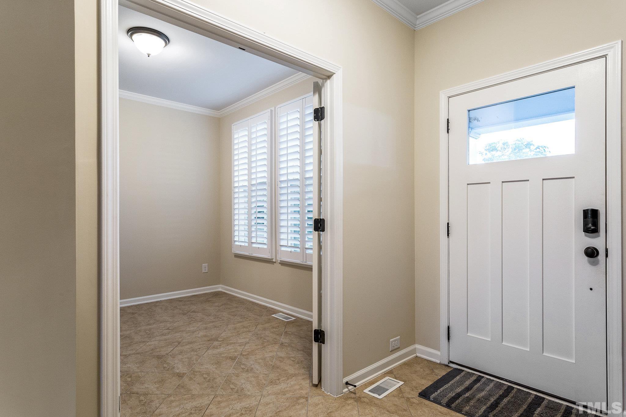 1214 Raleigh Street Oxford, NC 27565 - Photo 8 of 40 an empty room with windows and closet