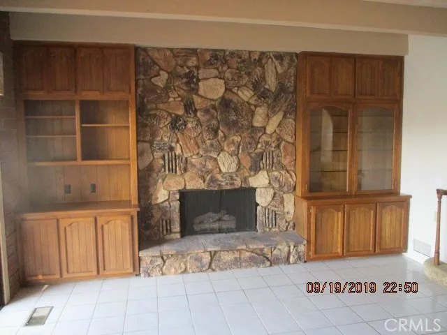 a view of fireplace and closet in a kitchen