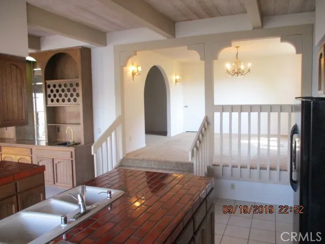 a view of living room and workspace