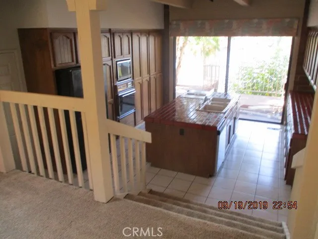 a view of a living room and entry way