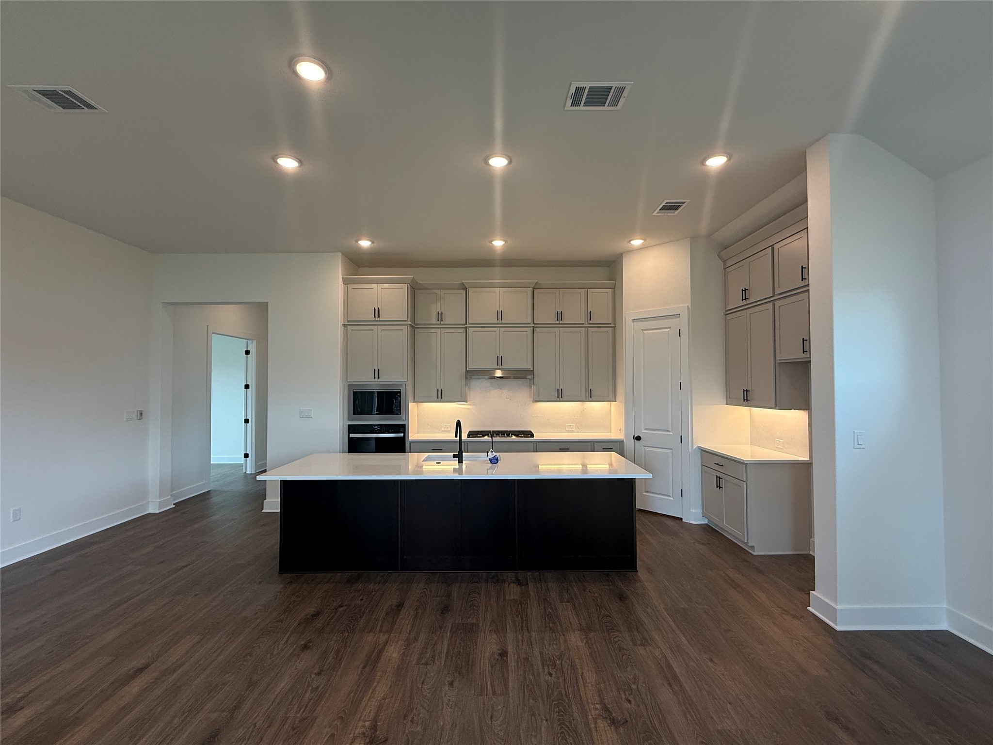 17336 Graces Path Pflugerville, TX 78660 - Photo 2 of 11 a view of kitchen and wooden floor