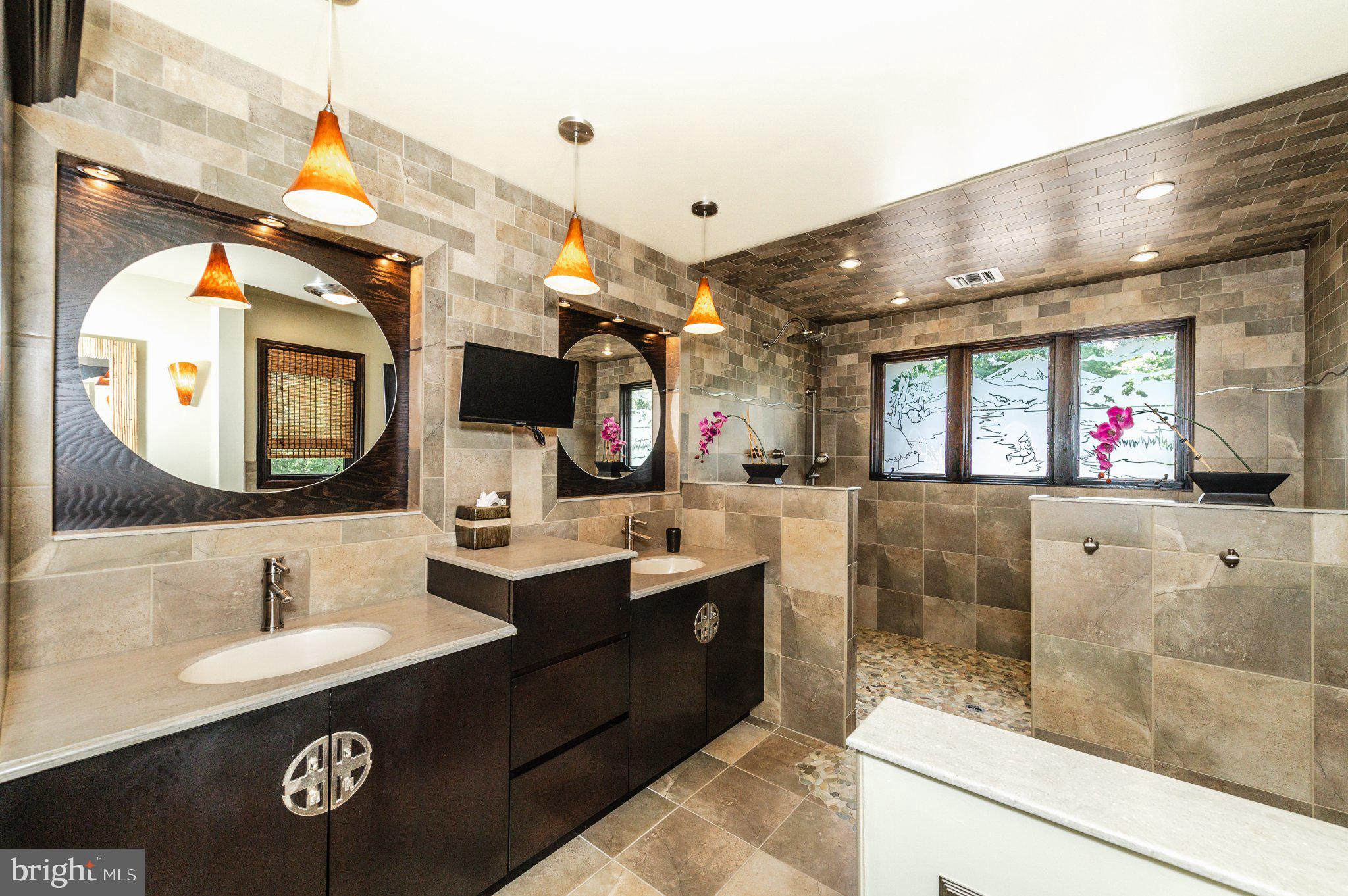 434 4th Street Atco, NJ 08004 - Photo 43 of 69 a bathroom with a sink a large mirror and a shower
