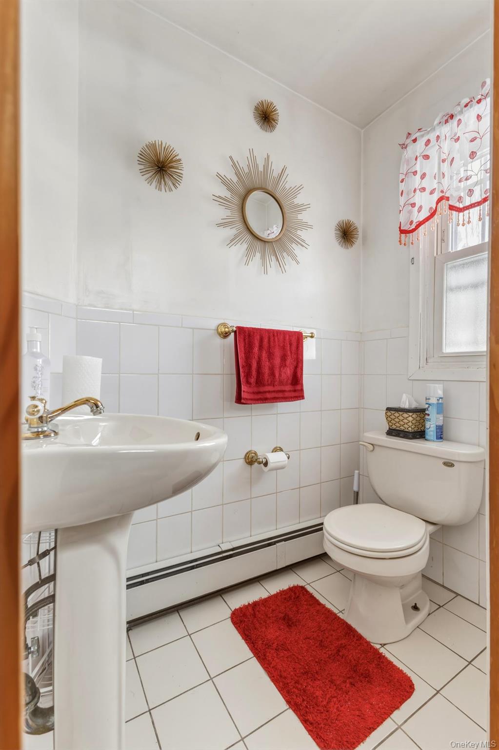 188-11 Dormans Road Queens, NY 11412 - Photo 11 of 32 a bathroom with a sink a toilet and shower