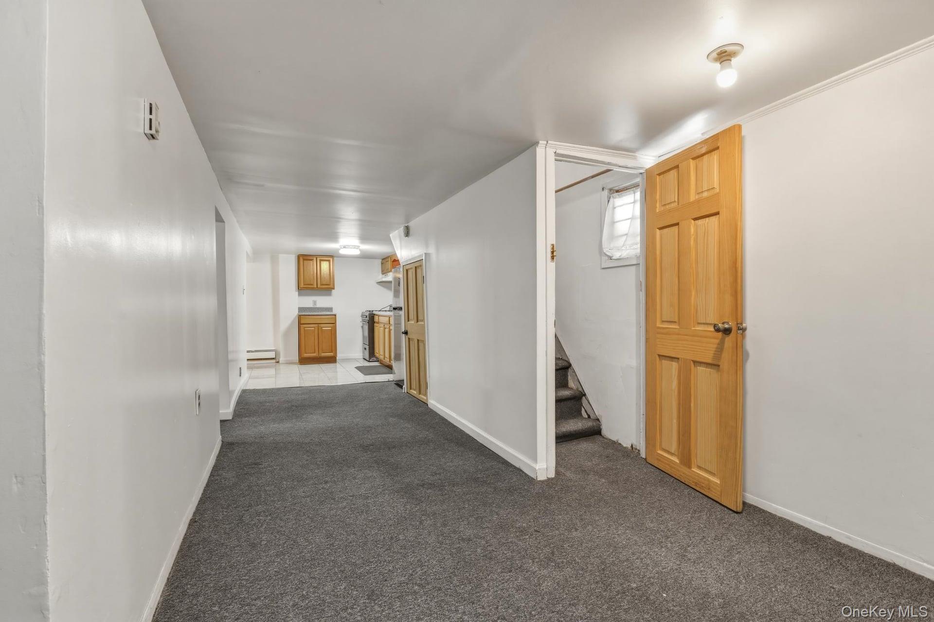 188-11 Dormans Road Queens, NY 11412 - Photo 12 of 32 a view of hallway with stairs